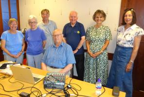 Ron (seated) is thanked by fellow Talking Hawick Paper volunteers